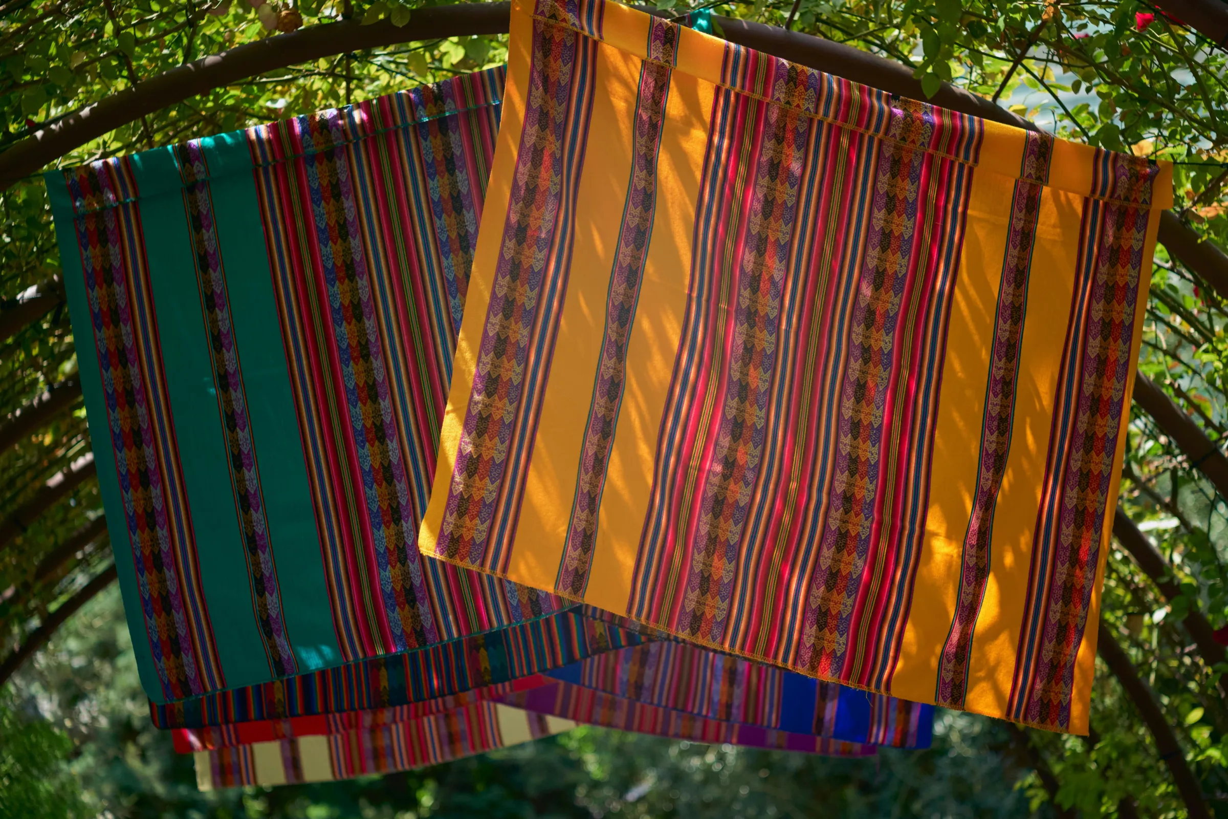 Striped handwoven textiles hanging outdoors