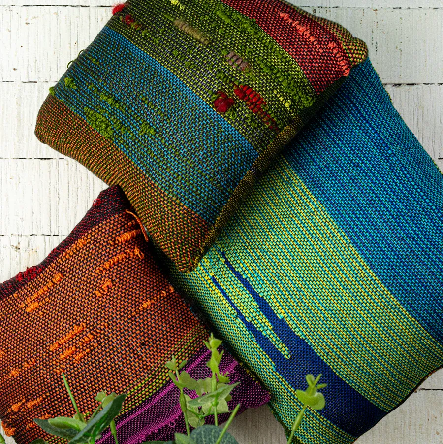 SAORI-woven cushions in blue, green and rust