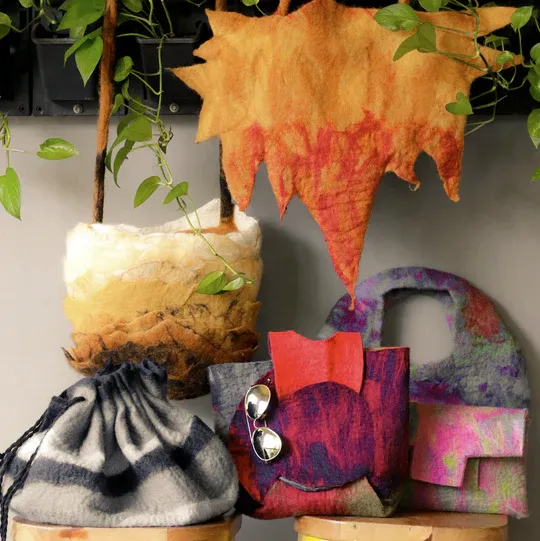 Wet-felted pieces: a vase, a drawstring bag, a bag and a leaf-shaped wall piece
