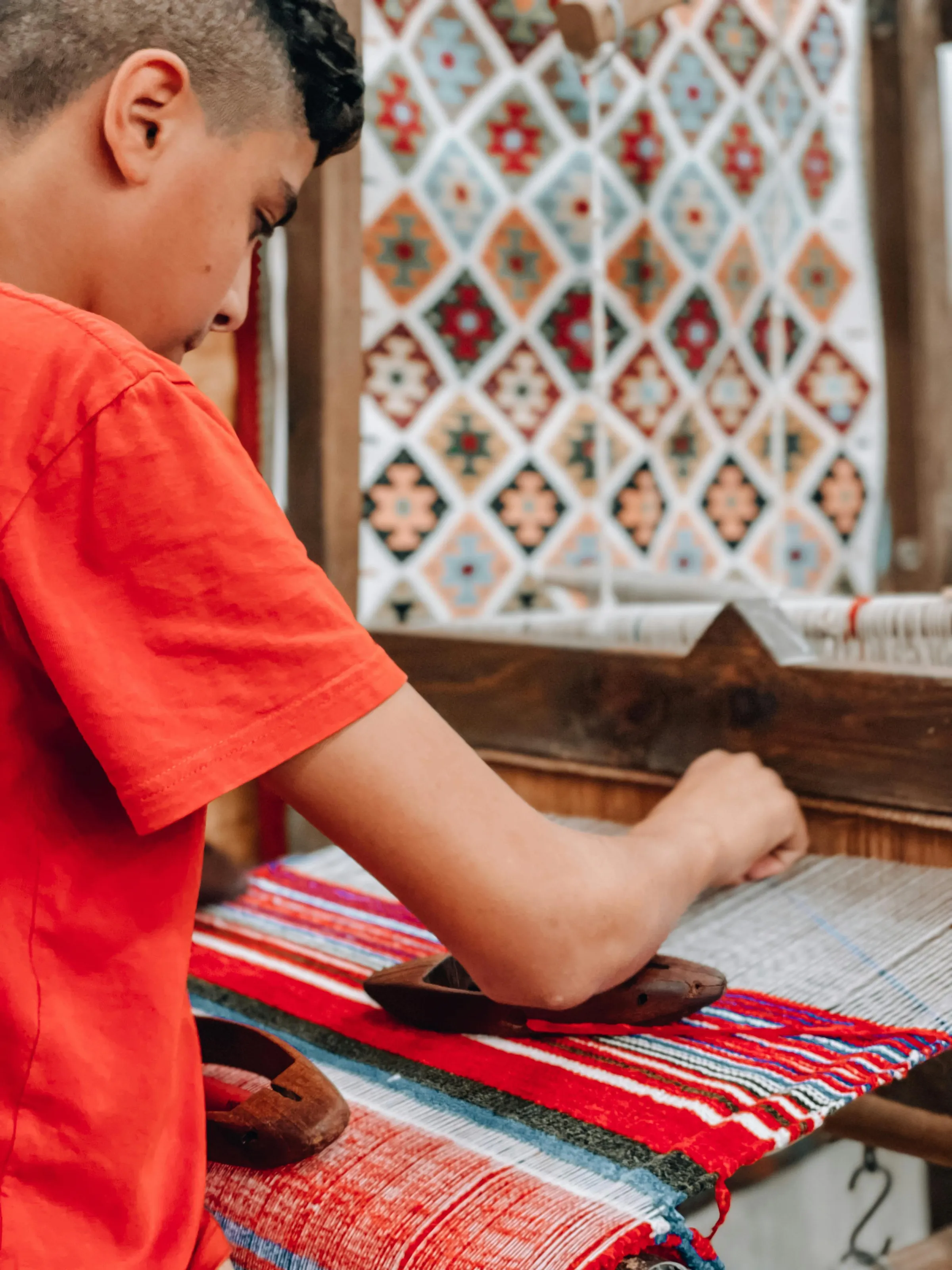 A young weaver at a loom