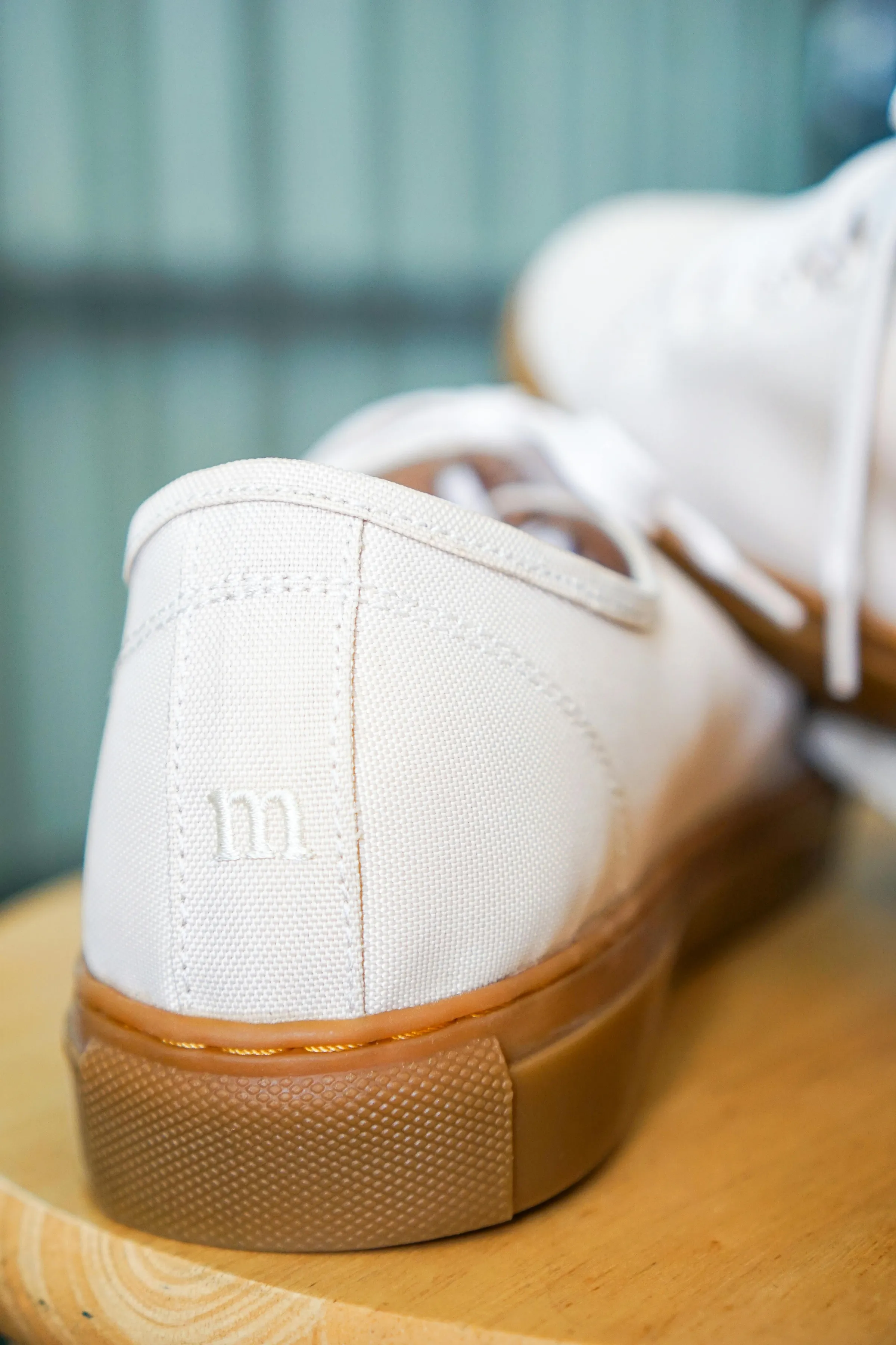 A white sneaker made with handwoven material
