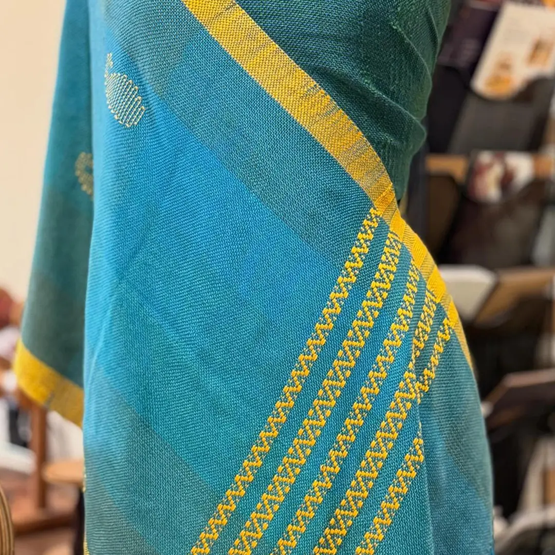 A handwoven sari border with a traditional pattern