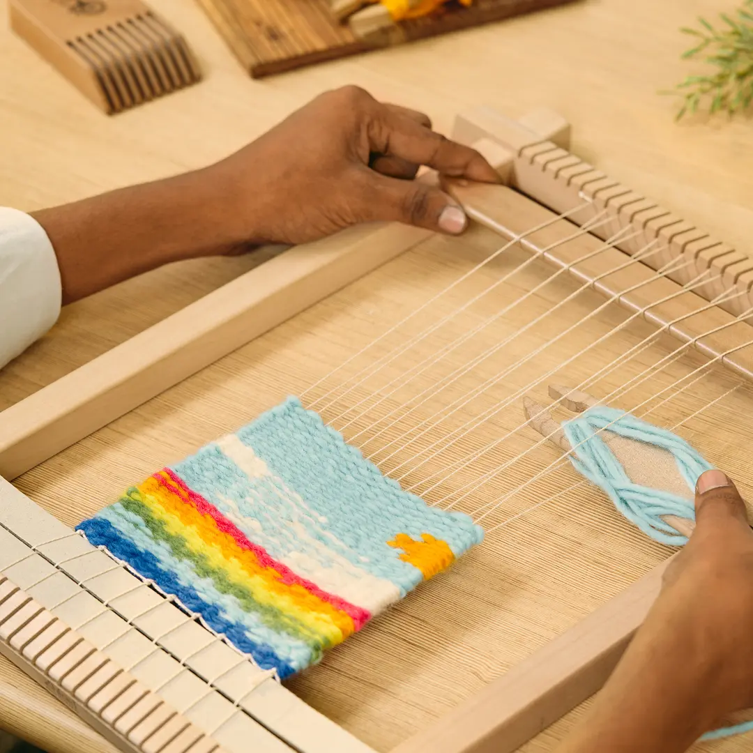 Weaving a colourful tapestry on a frame loom